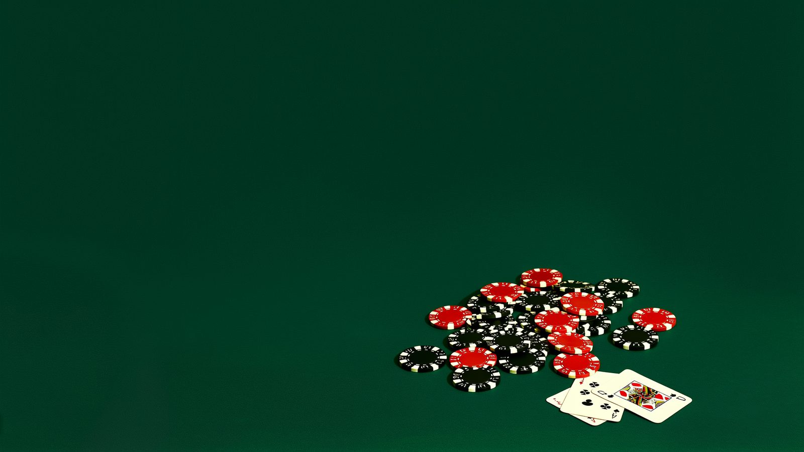 A loose pile of casino chips and two playing cards on green felt, representing the terms behind a bonus offer rather than its headline number.